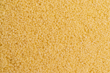 Dry couscous isolated on white background, soft light, copy space.