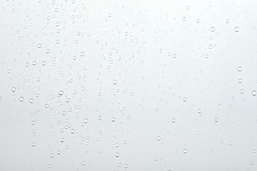 Water drops on white surface background.