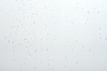 Water drops on white surface background.