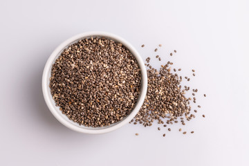 Chia seeds  isolated on white background, angle view, copy space, studio shot, soft light. Latin name (Salvia hispanica).