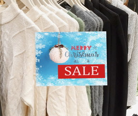 sale banner for season sale on blue background white Christmas ball with snowflakes and text