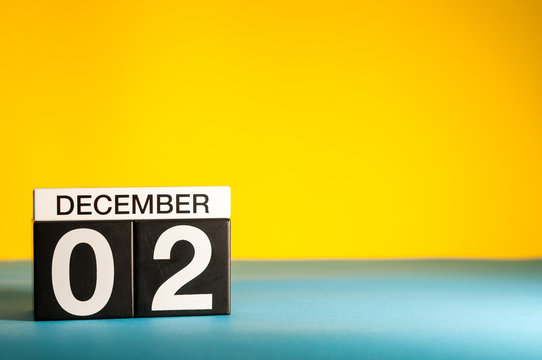 December 2nd. Image 1 day of december month, calendar on yellow background. Winter background with empty space for text, mockup
