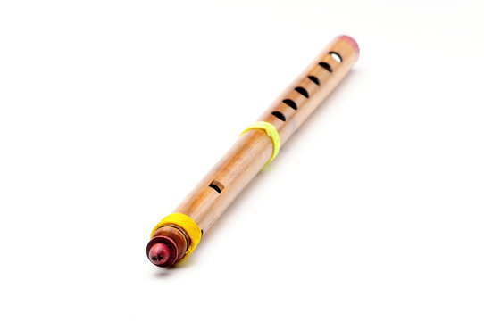 Bamboo wind instrument indian flute on white background