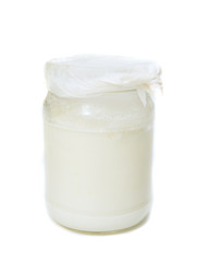 Glass jar with white dairy product