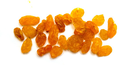 Dried raisins yellow raisins on a white background.