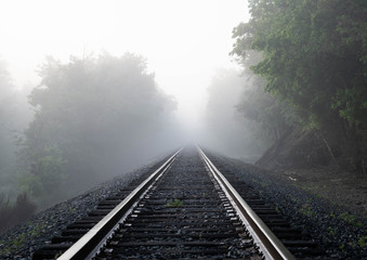 Railroad into morning fog 