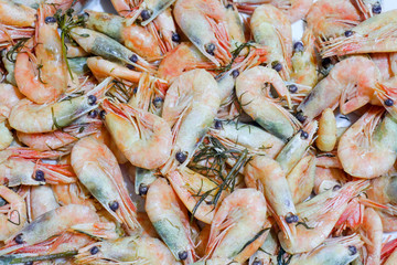 boiled shrimp with greens on the whole frame as a background