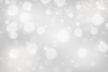 Silver bokeh background. Christmas glowing lights with sparkles. Holiday decorative effect.