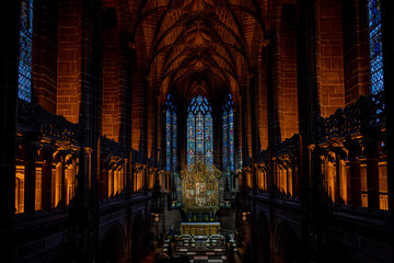 LIVERPOOL, ENGLAND, DECEMBER 27, 2018: The Lady Chapel in Liverpool Anglican Cathedral. Perspective view of a magnificent part inside the church, where light meets darkness all along place.