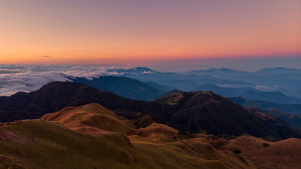 Fototapeta na wymiar Mt. Pulag Sunrise / Sunset with a Panoramic View Sea of Clouds in Kalinga Mountain Province Philippines