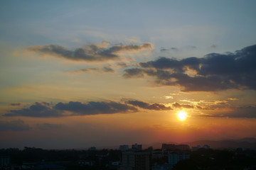 beautiful dramatic sunset sky above the city skyline
