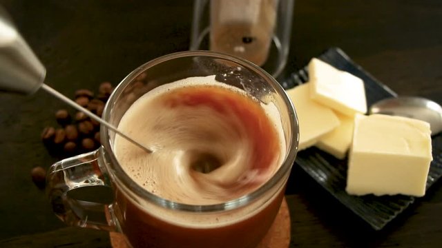 Using a milk frother in making butter coffee, bulletproof coffee. Convenient on the go method in blending fats into coffee.