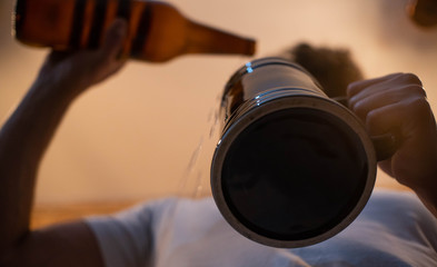Bartender hand serving a beer glass in a restaurant or pub