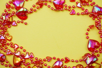Red heart bead border frame with space copy on Yellow background