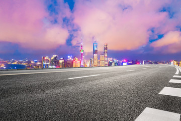 Asphalt highway and beautiful cityscape in Shanghai at night.