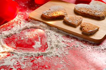 Valentine's red background decorative, Heart shape cookies and white icing flour, Valentine's day gift bakery concept for card or creative design.