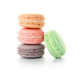 Different tasty macarons on white background