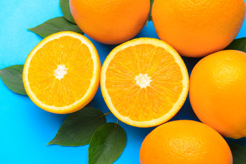 Fresh oranges on color background