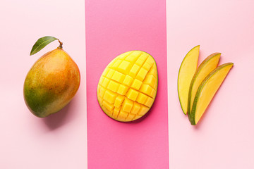 Tasty mango fruit on color background