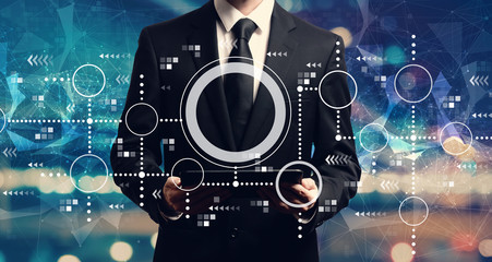 Connected circles chart with businessman holding a tablet computer