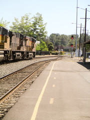 Obraz premium train on tracks near road