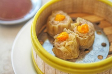 Crab Chinese steamed Dumpling with Salty Egg in bamboo steamer basket  - Chinese food Dimsum menu