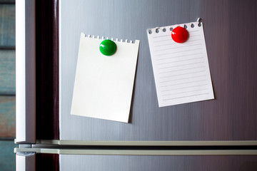 Abstract Empty paper sheet with magnet on refrigerator door. paper note background.