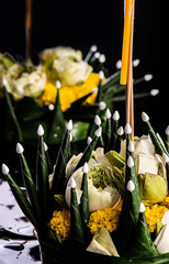 Krathong banana leaf decorated with flowers and joss sticks, candles. Ancient thai traditions