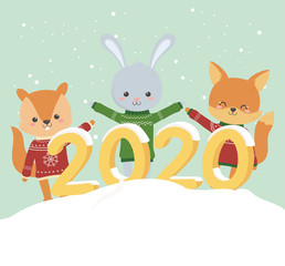 Obraz na płótnie Canvas happy new year 2020 celebration cute rabbit bear fox with sweater snow decoration