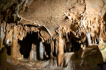 Stalactites, stalagmites and streak formations in cave of Balzarca. Moravian Karst. Czech Republic
