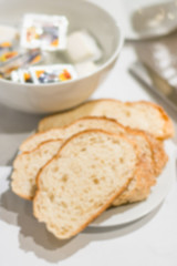 Abstract blur of hotel breakfast meal serve with bread