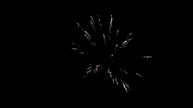 Flash of fireworks on black background to create a set salute on video for holiday new year, birthday, wedding or other celebration.