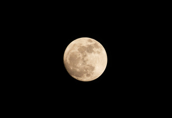 Full moon in the dark sky.