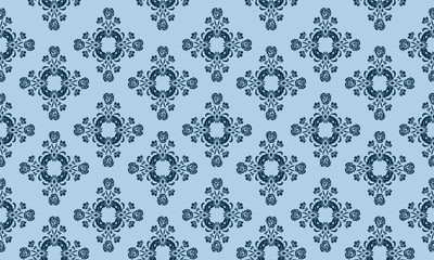 Ornate floral pattern on a light blue background.