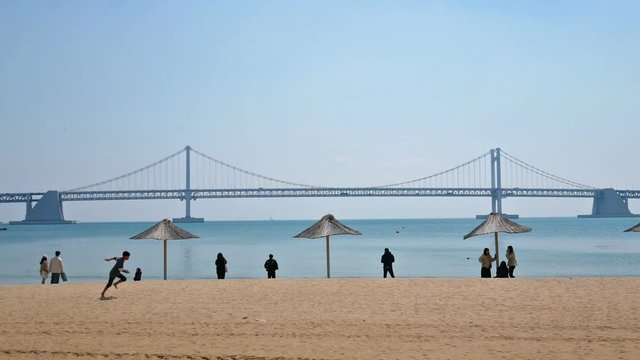 People enjoy at Gwangalli beach in Busan city of South Korea.
