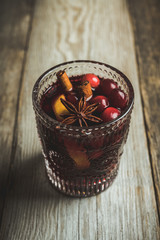 Mulled red wine on the rustic background. Selective focus. Shallow depth of field.