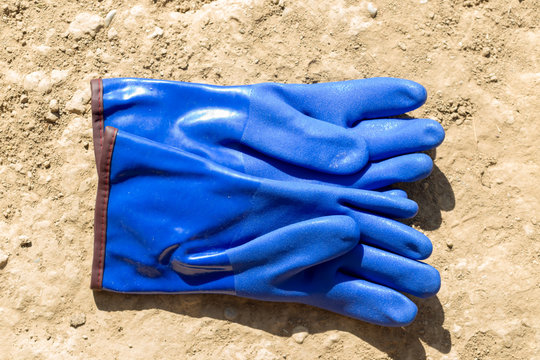 warm, blue rubber glove for construction work in the cold
