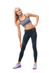 Full body portrait of young happy smiling blond beautiful girl, doing fitness exercise, isolated over white background