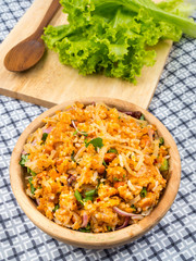 spicy minced pork salad in brown wooden bowl, minced pork mash with spicy, Thai food