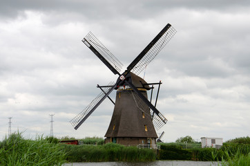 Fototapeta na wymiar An old windmill of Kinderdijk, UNESCO World Heritage Site, South Holland, the Netherlands, Europe