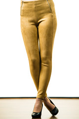Woman wearing mustard tight pants