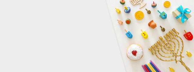 religion image of jewish holiday Hanukkah background with menorah (traditional candelabra), spinning top and doughnut