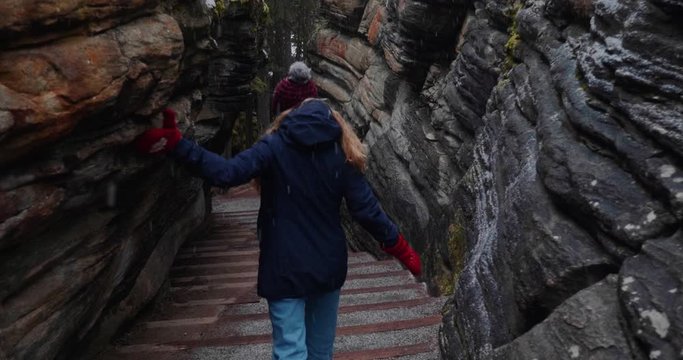 Young Canadian Women Walks Through Athabasca Canyon in Jasper National Park Alberta Canada