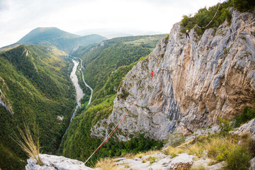 A man walks confidently along the highline.