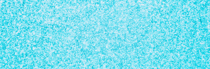 Winter snow texture blue background with small snowflakes for christmas concept, copy space for...