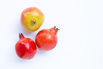Top view of ripe pomegranate fruit on white