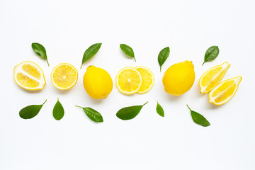Fresh lemon with green leaves on white.