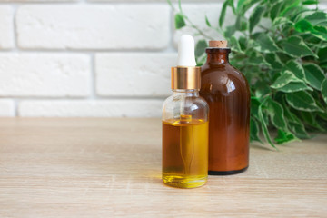 Glass bottles with oil serum and ubtan. Concept natural ogranic skincare cosmetic products