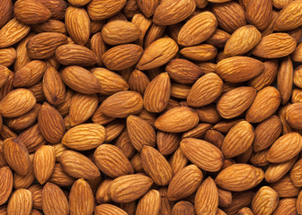 Almond background. Peeled almond kernels.