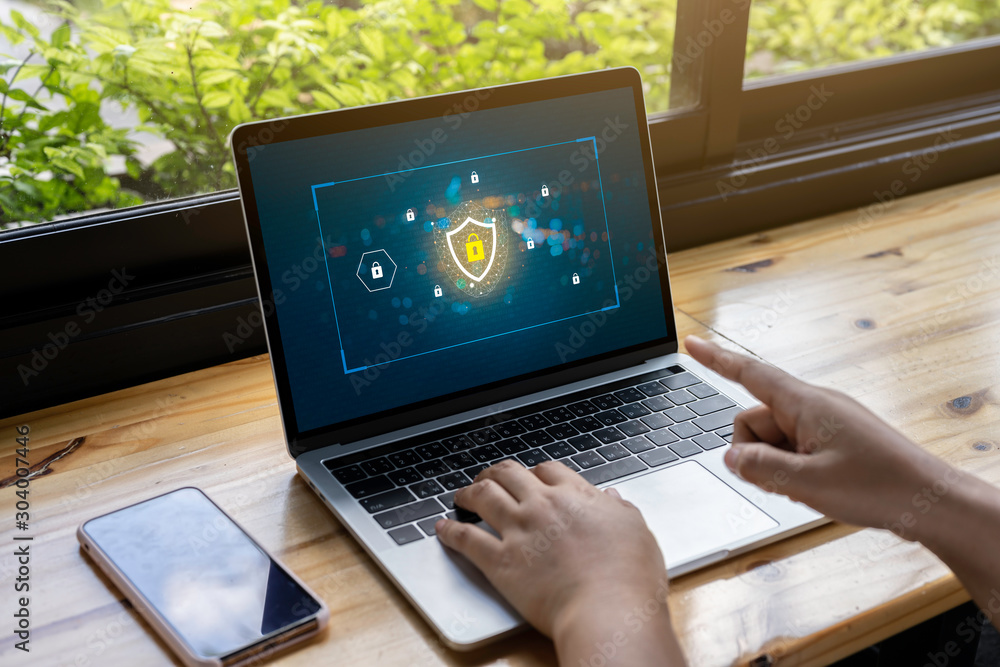 Poster person using a laptop computer with data protection, cyber security, information safety and encrypti